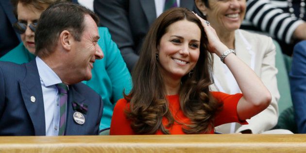 Kate, the Duchess of Cambridge, right, sits next to All England Lawn Tennis Club Chairman Philip Brook in the Royal Box on Centre Court, at the All England Lawn Tennis Championships in Wimbledon, London, Wednesday July 8, 2015. (AP Photo/Kirsty Wigglesworth)