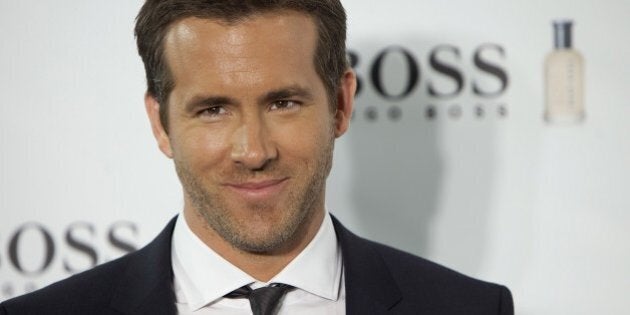 Canadian actor Ryan Reynolds poses for photographers during the 15th Anniversary of Boss Bottled Photocall at Eurostars Hotel in Madrid, Spain. Tuesday Nov. 26, 2013. (AP Photo/Abraham Caro Marin)