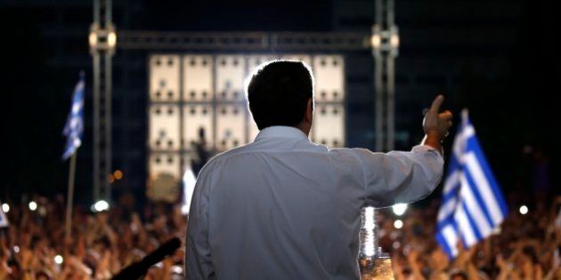 Greece's Prime Minister Alexis Tsipras delivers a speech during a rally organized by supporters of the No vote at Syntagma square in Athens, Friday, July 3, 2015. A new opinion poll shows a dead heat in Greece's referendum campaign with just two days to go before Sunday's vote on whether Greeks should accept more austerity in return for bailout loans. (Yannis Behrakis/Pool via AP)