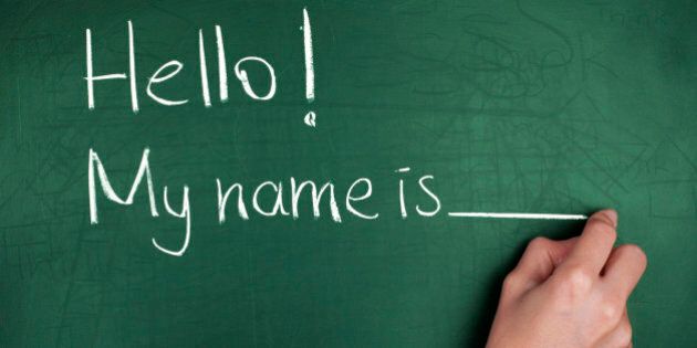 Woman hand writing ' Hello! My name is... ' on green blackboard