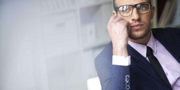 Portrait of attractive male in suit and eyeglasses