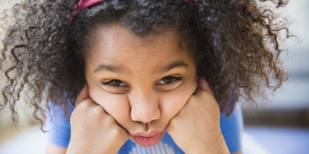 Close up of African American girl making a face