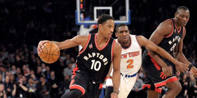 Toronto Raptors guard DeMar DeRozan (10) drives the basket as New York Knicks guard Langston Galloway (2) gets by a pick by Raptors' Bismack Biyombo during the first quarter of an NBA basketball game Monday, Feb. 22, 2016, at Madison Square Garden in New York. (AP Photo/Bill Kostroun)