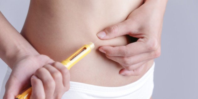 close up of woman inject drugs...