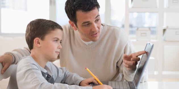 Father helping son with homework