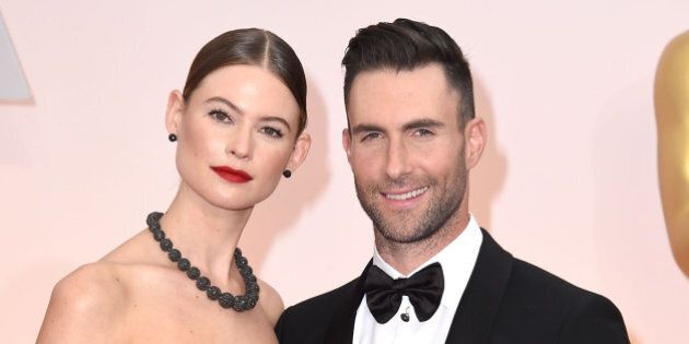 HOLLYWOOD, CA - FEBRUARY 22: Behati Prinsloo and Adam Levine arrives at the 87th Annual Academy Awards at Hollywood & Highland Center on February 22, 2015 in Hollywood, California. (Photo by Steve Granitz/WireImage)
