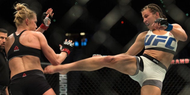 LAS VEGAS, NV - MARCH 5: (R-L) Miesha Tate kicks Holly Holm during their women's bantamweight championship bout during the UFC 196 in the MGM Grand Garden Arena on March 5, 2016 in Las Vegas, Nevada. (Photo by Brandon Magnus/Zuffa LLC/Zuffa LLC via Getty Images)