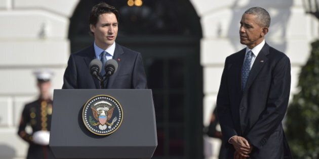 US President Barack Obama and Canada's Prime Minister Justin Trudeau take part in a welcome ceremony during a State Visit on the South Lawn of the White House on March 10, 2016 in Washington, DC. / AFP / MANDEL NGAN (Photo credit should read MANDEL NGAN/AFP/Getty Images)