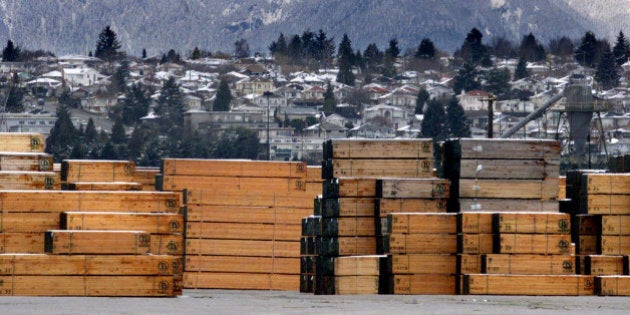 Piles of softwood lumber destined for export, are stacked at a Richmond, B.C., Canada lumberyard, March 20, 2002. Canadian and U.S. officials said Tuesday, July 29, 2003, they have reached a tentative deal to settle a long-running dispute over imports of Canadian softwood lumber used to build homes in the United States. (AP Photo/CP/Richard Lam, File)