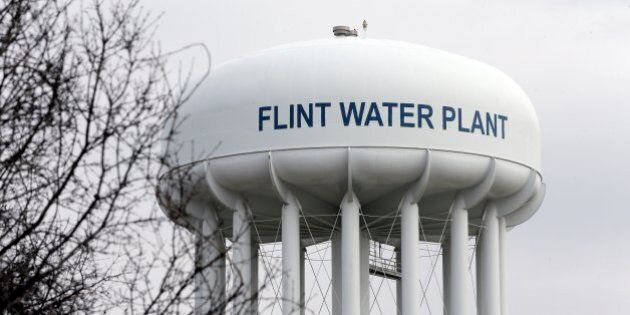 FILE - This Feb. 5, 2016 file photo shows the Flint Water Plant tower in Flint, Mich. Michigan, seeking to prevent another oversight fiasco after lead poisoning in Flint and a deadly Legionnaires' disease outbreak in the area, is considering new water testing rules for hospitals and possible changes to how large facilities manage their water systems that could include new monitoring requirements. (AP Photo/Carlos Osorio, File)