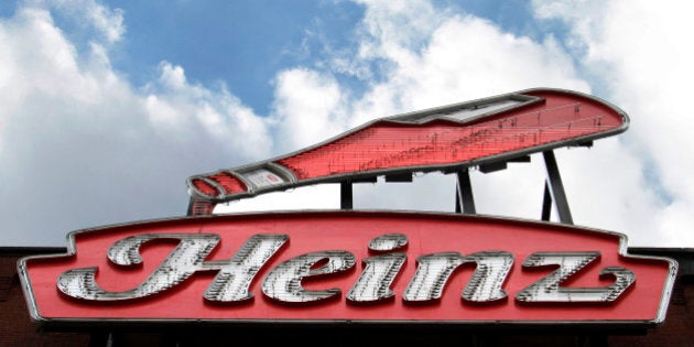 This photo shows a neon Heinz ketchup sign on the side of the Senator John Heinz History Center in Pittsburgh, Wednesday, March 25, 2015. H.J. Heinz Co. is buying Kraft Foods Group Inc., creating what the companies say will be the third-largest food and beverage company in North America, the companies announced Wednesday. (AP Photo/Gene J. Puskar)