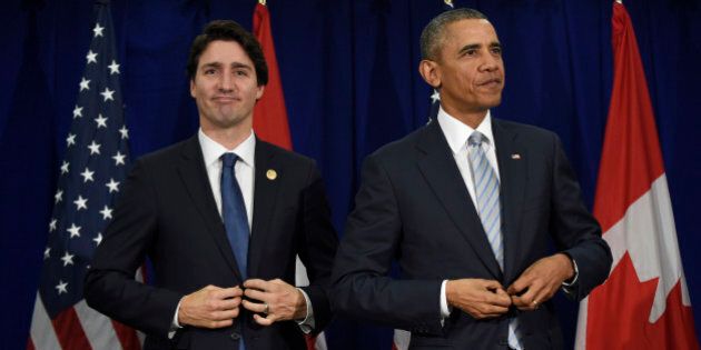 U.S. President Barack Obama, right, and Canadas Prime Minister Justin Trudeau stand up following their bilateral meeting at the Asia-Pacific Economic Cooperation summit in Manila, Philippines, Thursday, Nov. 19, 2015. (AP Photo/Susan Walsh)