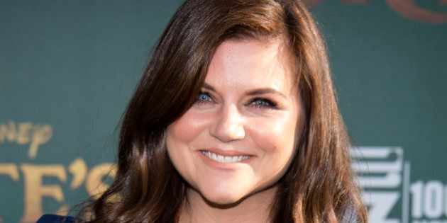 Actress Tiffani Thiessen attends the Disney premiere of 'Pete's Dragon' at El Capitan Theater in Hollywood, California, on August 8, 2016. / AFP / VALERIE MACON (Photo credit should read VALERIE MACON/AFP/Getty Images)