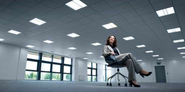 businesswoman admires her new empty offices