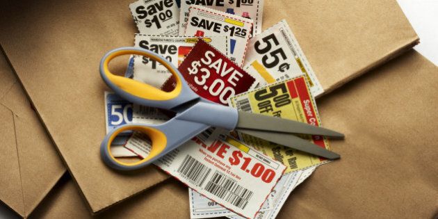 Savings coupons and scissors shot on shopping bags with soft drop shadow