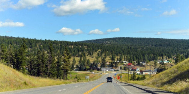 Summer day for a road trip through British Columbia, Canada. Highway 1 leading into a small town.