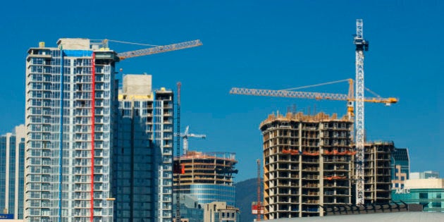 Cranes and towering skyscrapers shape the Vancouver Skyline, Vancouver, British Columbia, Canada.