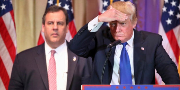 Republican presidential candidate Donald Trump shields his eyes as he listens to a question as he speaks on Super Tuesday primary election night at the White and Gold Ballroom at The Mar-A-Lago Club in Palm Beach, Fla., Tuesday, March 1, 2016. (AP Photo/Andrew Harnik)