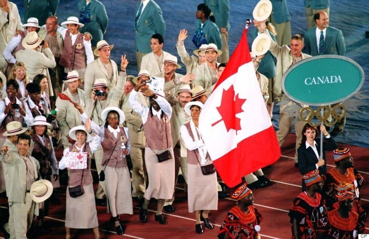 Canadian Olympic Athletes Celebrate in Retro Inspired Red Podium