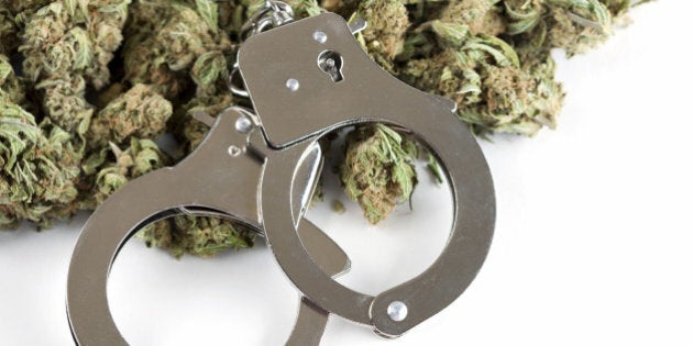 Marijuana and handcuffs conceptual image for criminal aspects of the drug.