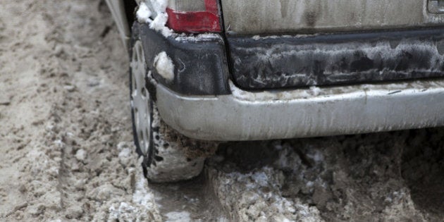 Car under the snow. Winter trouble