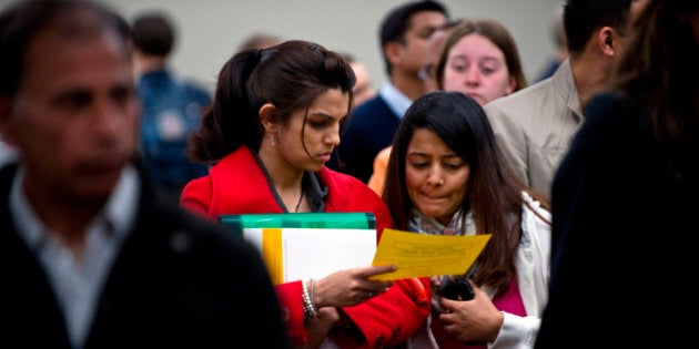 Job-seekers wait in line to meet with career advisors at the Canada Job Expo held at North York Memorial Hall in Toronto, Ontario, Canada, on Tuesday, May 28, 2013. Canadian employers added fewer jobs than forecast in April, fueling concern the nationâs economic recovery is slowing. Photographer: Galit Rodan/Bloomberg via Getty Images