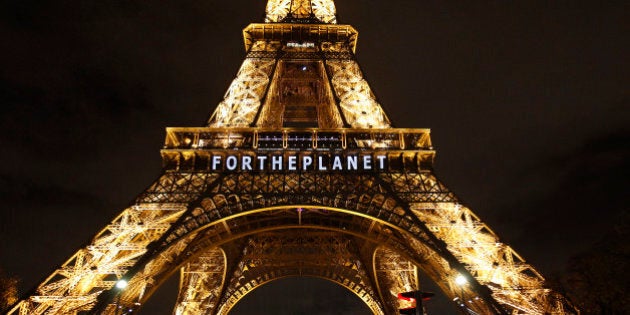 PARIS, FRANCE - DECEMBER 11: The slogan 'For the planet' is projected on the Eiffel Tower as part of the World Climate Change Conference 2015 (COP21) on December 11, 2015 in Paris, France. COP21 President Laurent Fabius unveiled the final draft text of a global climate agreement of negotiations in Paris. (Photo by Chesnot/Getty Images)