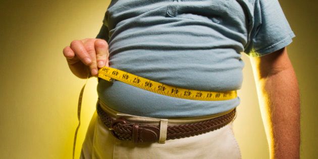 Man measuring his waist