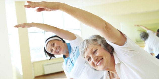 Portrait of sporty females doing physical exercise in sport gym