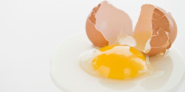 Close up of fried egg with cracked eggshell