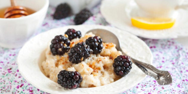 Homemade Oatmeal with Blackberries, granola and honey for Breakfast