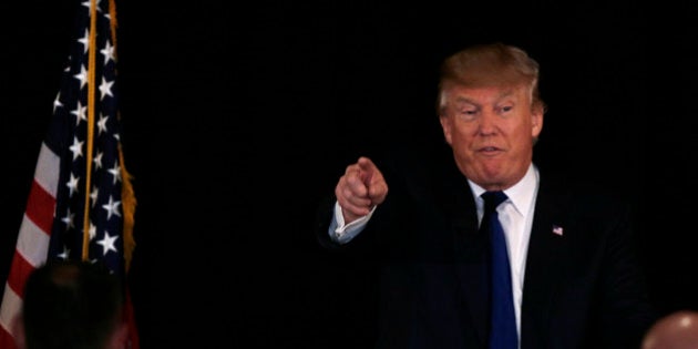 Republican presidential candidate, businessman Donald Trump gestures at a regional police union meeting in Portsmouth, N.H., Thursday, Dec. 10, 2015. (AP Photo/Charles Krupa)