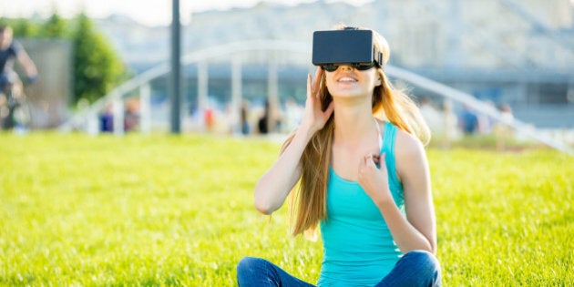 Girl with pleasure uses head-mounted display