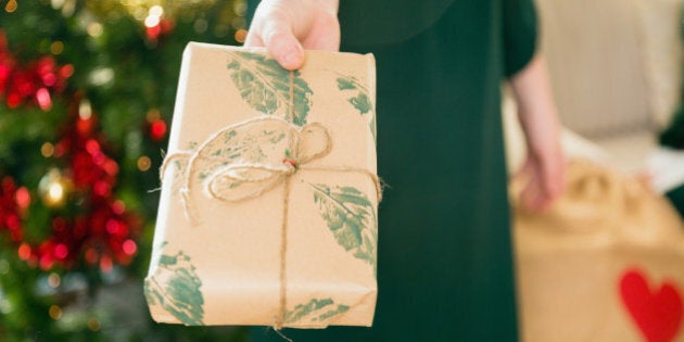 brown paper, natural, handmade, craft, ribbon, leaves, giving, torso, close up, indoors, christmas, lifestyles, christmas decorations, cultures, domestic life,