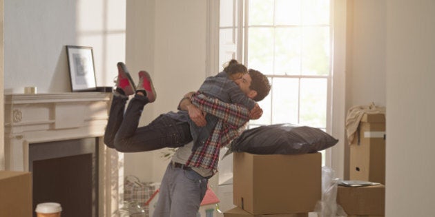 A couple celebrating moving in to a new home