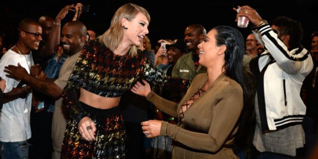 LOS ANGELES, CA - AUGUST 30: Taylor Swift and Kim Kardashian West attend the 2015 MTV Video Music Awards at Microsoft Theater on August 30, 2015 in Los Angeles, California. (Photo by Kevin Mazur/MTV1415/WireImage)