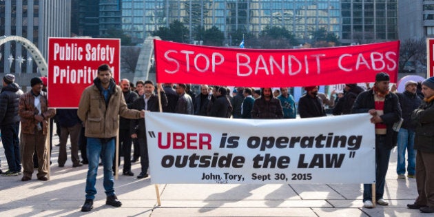 TORONTO, ONTARIO, CANADA - 2015/12/09: Toronto taxi drivers protest against the operation of UberX who was deemed illegal by the city until new regulation bylaws are approved. UberX is giving unfair competition to the taxi industy. (Photo by Roberto Machado Noa/LightRocket via Getty Images)