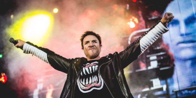 British singer Simon Le Bon (Simon John Charles Le Bon) in concert with Duran Duran. On the screen behind him there is the realistic robotic face of one of the characters of the music video The Wild Boys. Paper Gods Tour, Assago Summer Arena. Milan (Italy), 12th June 2016 (Photo by Francesco Castaldo/Archivio Francesco Castaldo/Mondadori Portfolio via Getty Images)