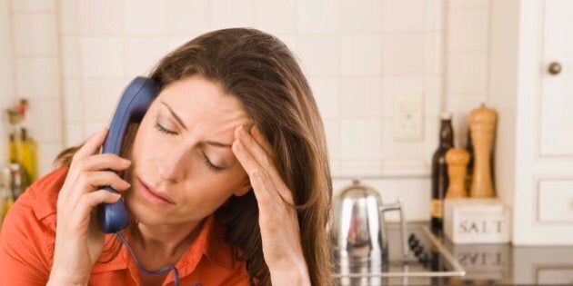 Distressed woman on telephone