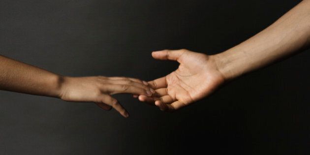 Mixed race couple holding hands
