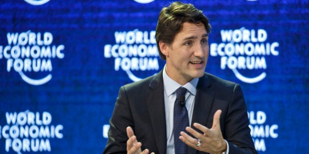 Canada's Prime Minister Justin Trudeau gestures as he speaks during a panel