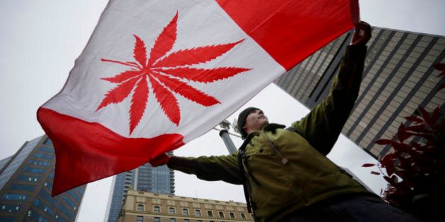 [UNVERIFIED CONTENT] A pot supporter holds up a flag to celebrate the International Cannabis Day in Downtown Vancouver, British Columbia, Canada