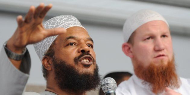 Controversial German Islamist preacher Pierre Vogel (R) and Abu Ameenah Bilal Philips, an Islamic scholar criticised as hate preacher, speak to their supporters during a demonstration on April 20, 2011 in Frankfurt/M., western Germany. Vogel, also known as Abu Hamza, had called for the demonstration titled 'Islam - the misunderstood religion'. AFP PHOTO ARNE DEDERT GERMANY OUT (Photo credit should read ARNE DEDERT/AFP/Getty Images)