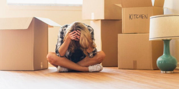 USA, Florida, Jupiter, Young woman during moving into new house