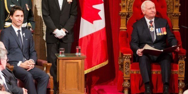 Prime Minister Justin Trudeau listens as Governor General David Johnston delivers the Speech from the Throne to the start Canada's 42nd parliament Ottawa, Canada on December 4, 2015. AFP PHOTO/GEOFF ROBINS / AFP / GEOFF ROBINS (Photo credit should read GEOFF ROBINS/AFP/Getty Images)