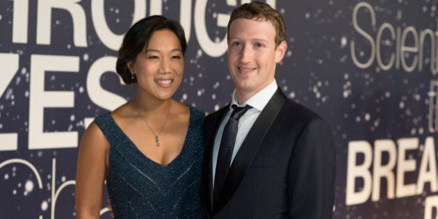 Priscilla Chan and Mark Zuckerberg arrive at the 2nd Annual Breakthrough Prize Award Ceremony at the NASA Ames Research Center on Sunday, Nov. 9, 2014 in Mountain View, California. (Photo by [Peter Barreras]/Invision/AP)