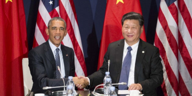 PARIS, Nov. 30, 2015 -- Chinese President Xi Jinping, right, meets with his U.S. counterpart Barack Obama in Paris, France, Nov. 30, 2015. (Xinhua/Huang Jingwen via Getty Images)