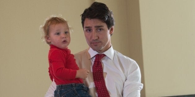 Canadian Liberal Party leader Justin Trudeau waits with his son Hadrien to cast his ballot in Montreal on October 19, 2015.The first of 65,000 polling stations opened Monday on Canada's Atlantic seaboard for legislative elections that pitted Prime Minister Stephen's Tories against liberal and social democratic parties. Up to 26.4 million electors are expected to vote in 338 electoral districts. Some 3.6 million already cast a ballot in advance voting a week ago, and the turnout Monday is expected to be high. AFP PHOTO/NICHOLAS KAMM (Photo credit should read NICHOLAS KAMM/AFP/Getty Images)