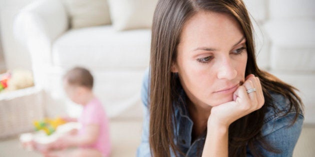 Mother with daughter (6-11 months) in living room