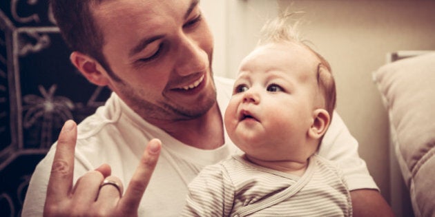 Father with his baby girl listening punk rock music